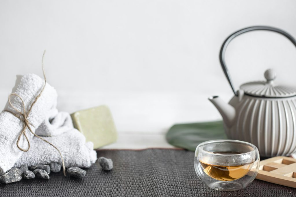 Spa composition with bath accessories and tea copy space.